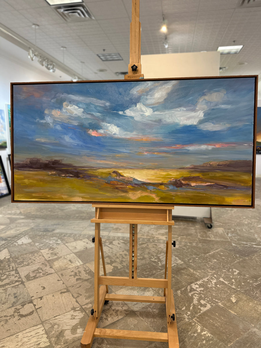 The same painting in a chestnut wood floating frame, on an easel in Butter Gallery