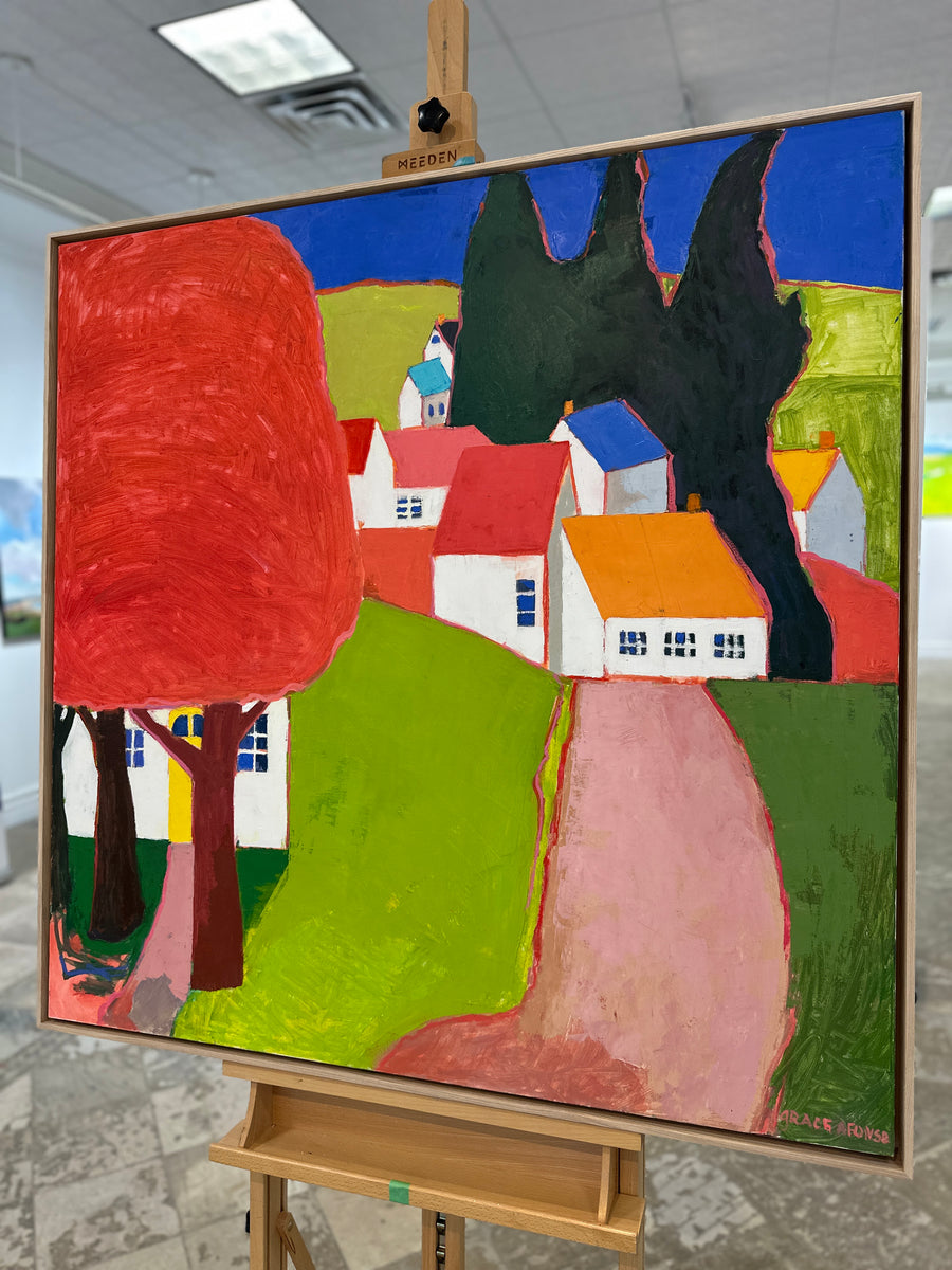 The same painting in a natural wood floating frame, on an easel in Butter Gallery